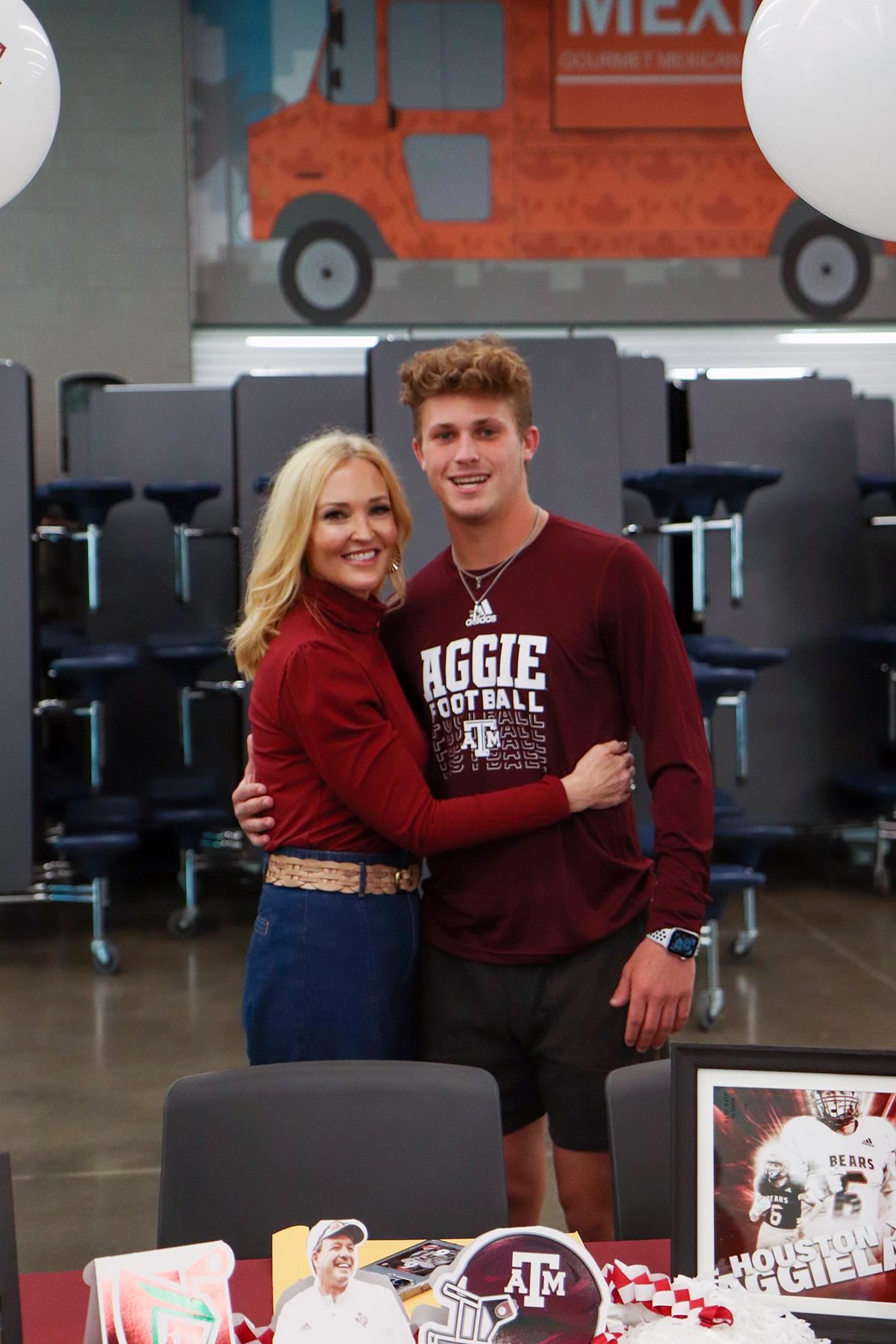 Bridgeland High School senior Andrew Maleski, right, smiles after signing a letter of intent to Texas A&M University.
